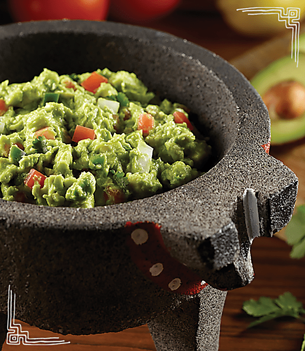 Made to order guacamole in a molcajete