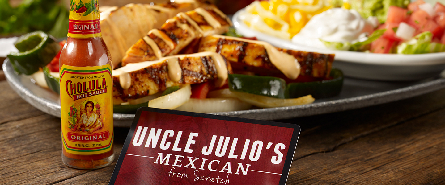 cholula fajitas with bottle of cholula hot sauce and uncle julio's gift card