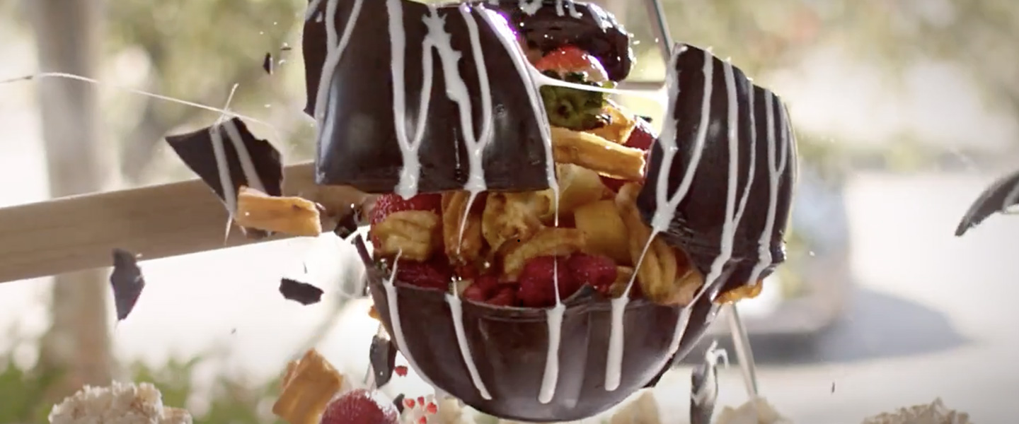 chocolate piñata filled with churros and fruit