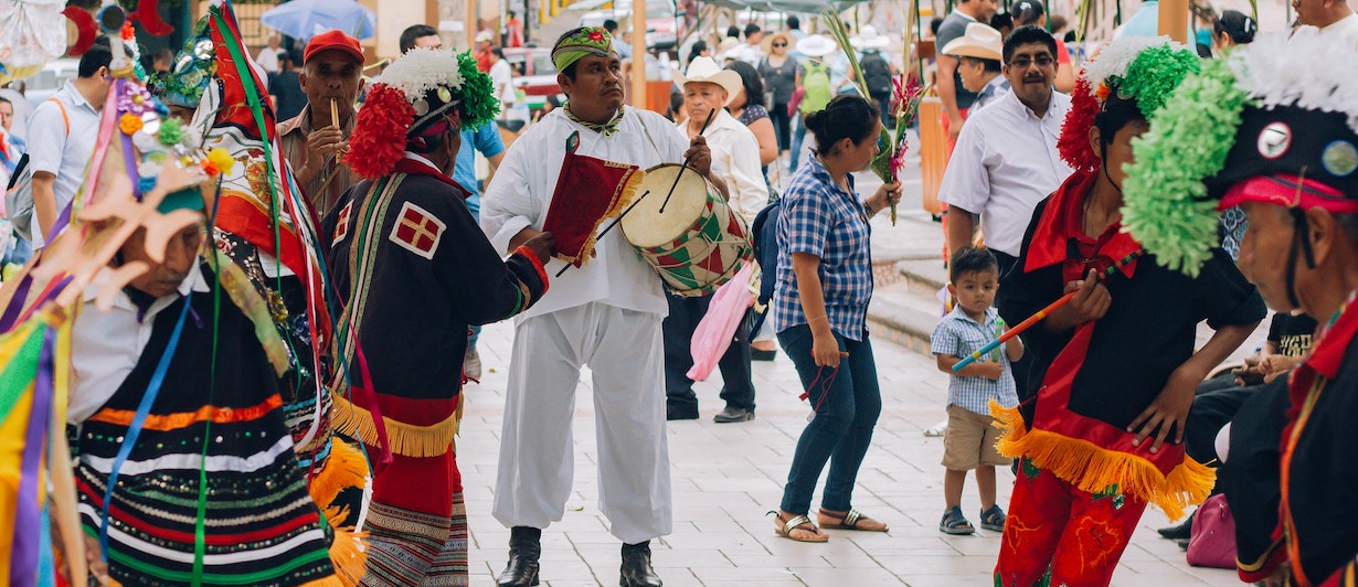 Traditional Hispanic dancers and artists dancing around the streets of Mexico.